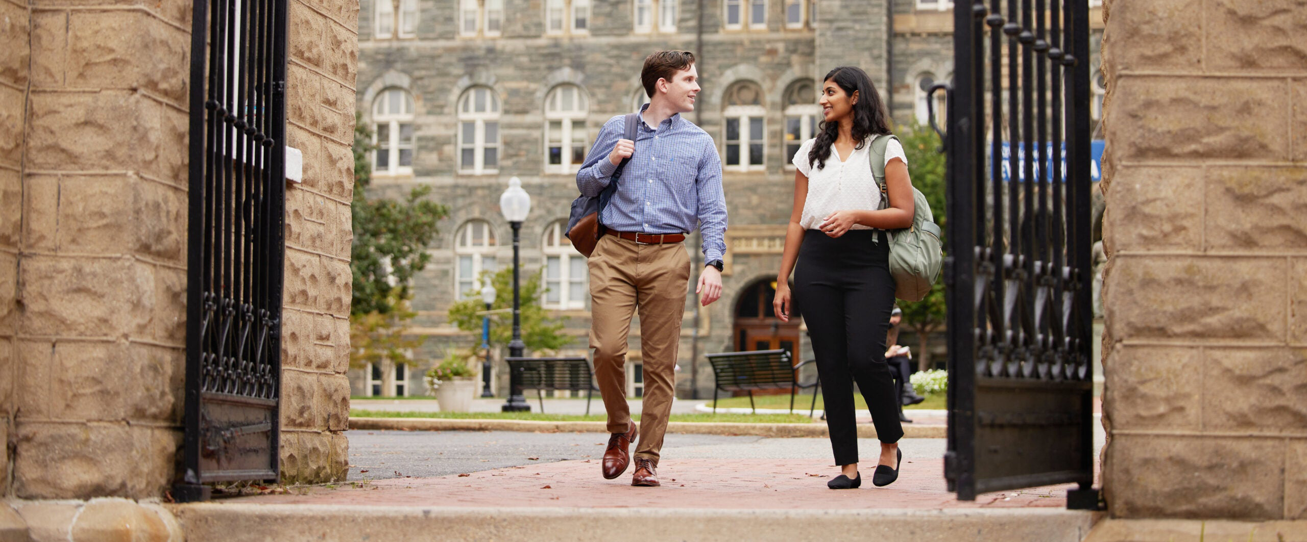 two students walking in front of Georgetown's campus
